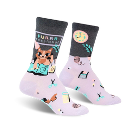 light purple socks with gray toe, heel, and cuff. cartoon cat wearing glasses and a pink bowtie on a stack of books. yarn, scissors, tape measure, and clock images. womens crew length.  