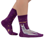 Lifestyle photo showing the Llama Shimmer socks on a model's feet.