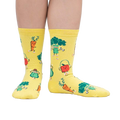 Lifestyle shot of Plant Powered socks on a person's feet, showcasing the fun design in action.