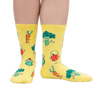 Lifestyle shot of Plant Powered socks on a person's feet, showcasing the fun design in action.