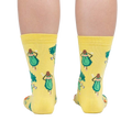 Rear view of a person wearing Plant Powered socks, highlighting the design on the back of the socks.