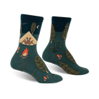 Crew socks in teal, navy, and orange, showcasing a whimsical camping scene with a tent, campfire, and forest elements.