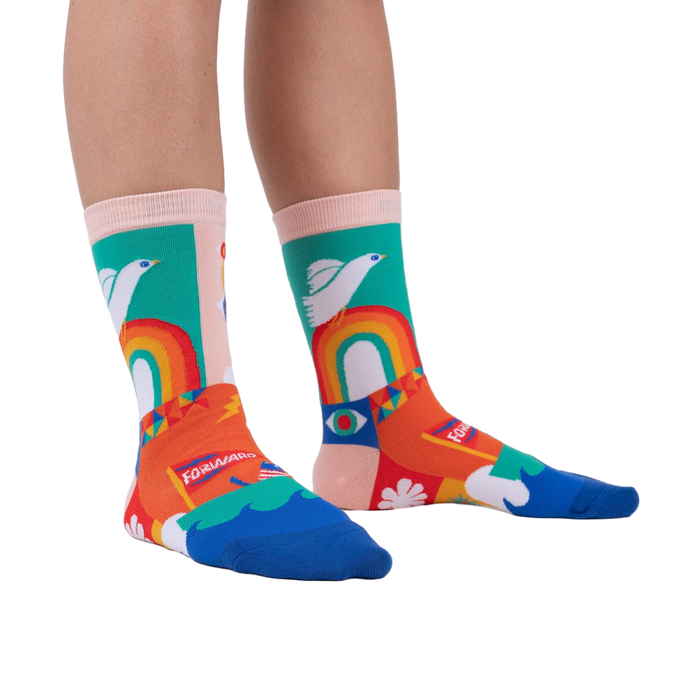 A person's legs wearing the Peace and Love socks.  Shows off the socks' vibrant colors and design in a lifestyle setting.