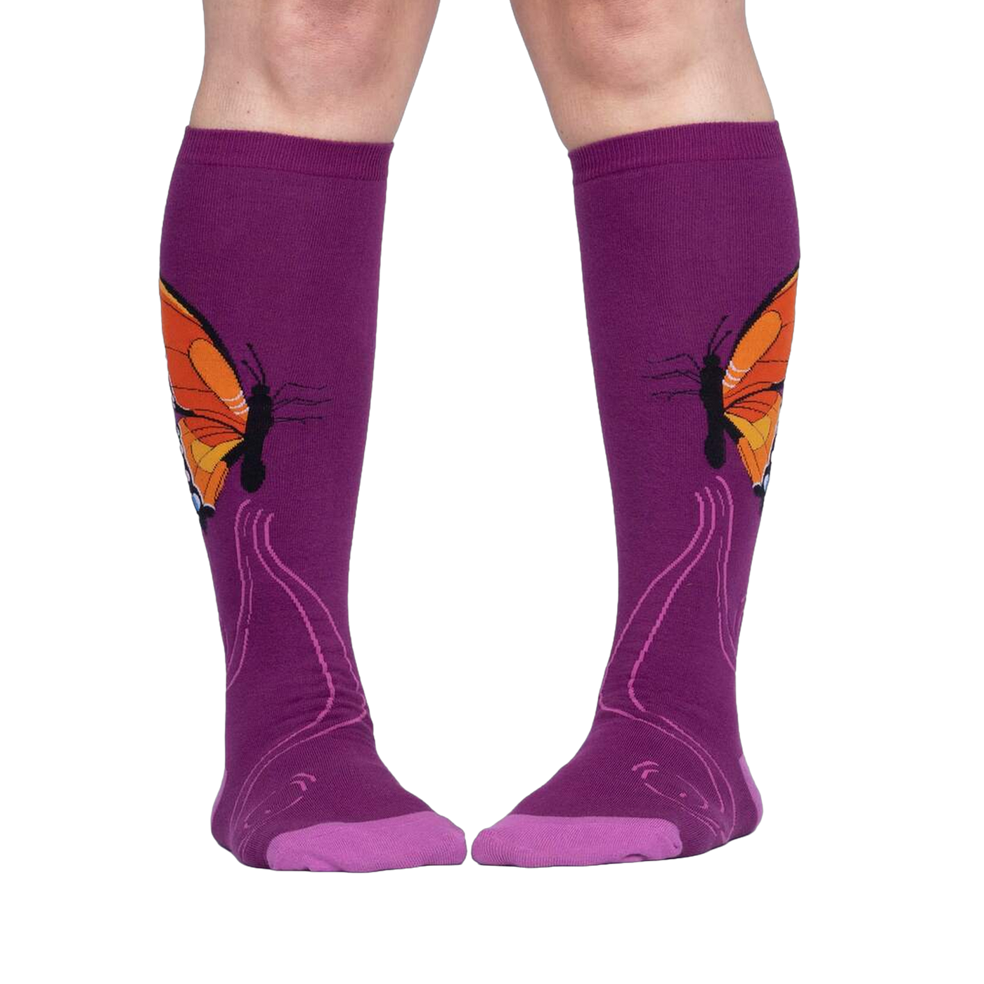 Lifestyle shot: A person is wearing purple knee-high socks with an orange butterfly design.
