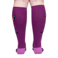 Back view of a person wearing purple knee-high socks with an orange butterfly design.