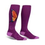Pair of purple knee-high socks with an orange butterfly design and swirling accents.  The socks have a light purple cuff.