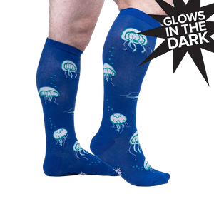 Lifestyle shot of model wearing 'Nice to Sea You' knee-high socks, showcasing the fit and design.