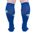 Rear view of 'Nice to Sea You' socks on a model, highlighting the full jellyfish print on the back.