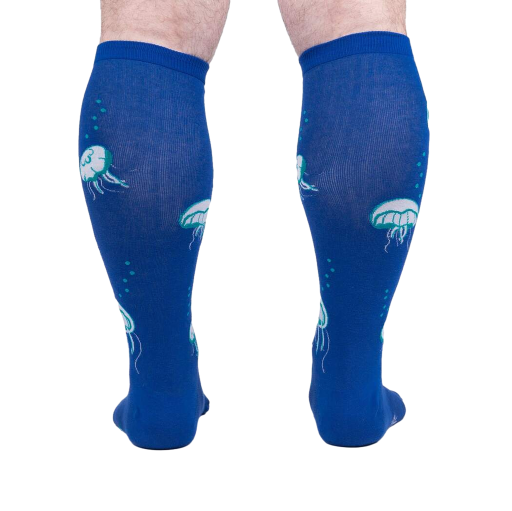 Rear view of 'Nice to Sea You' socks on a model, highlighting the full jellyfish print on the back.