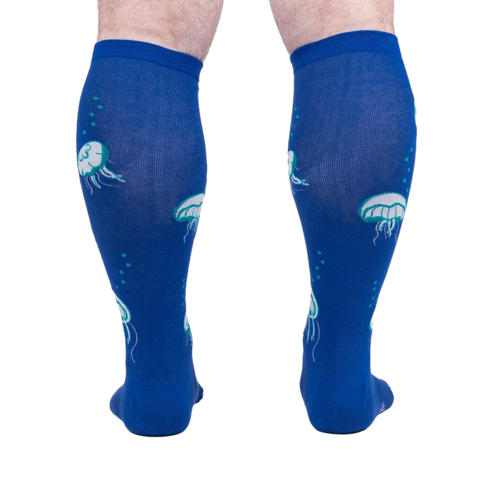Rear view of 'Nice to Sea You' socks on a model, highlighting the full jellyfish print on the back.