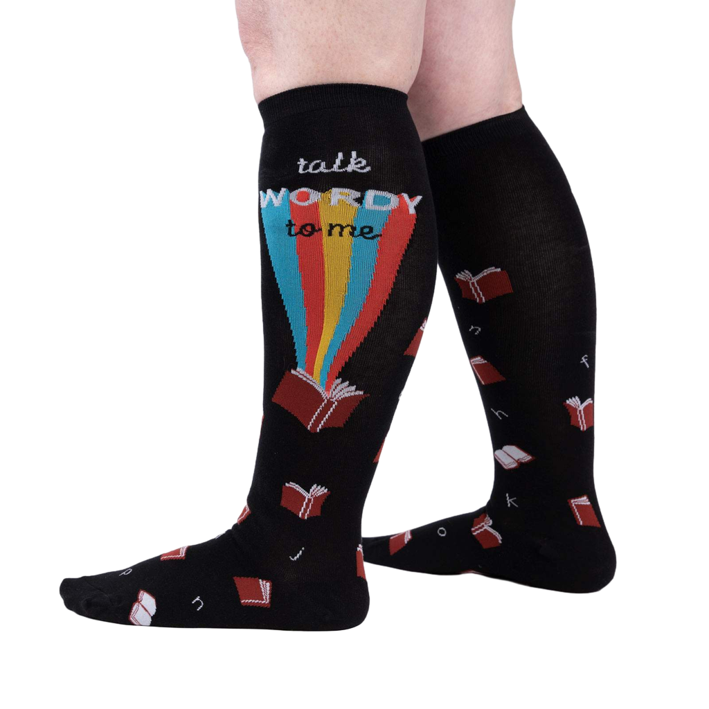 Lifestyle shot of a person wearing the 'Talk Wordy To Me' socks, showcasing how they look when worn.