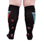 Back view of the 'Talk Wordy To Me' socks on a person's legs.  Shows the complete sock design.