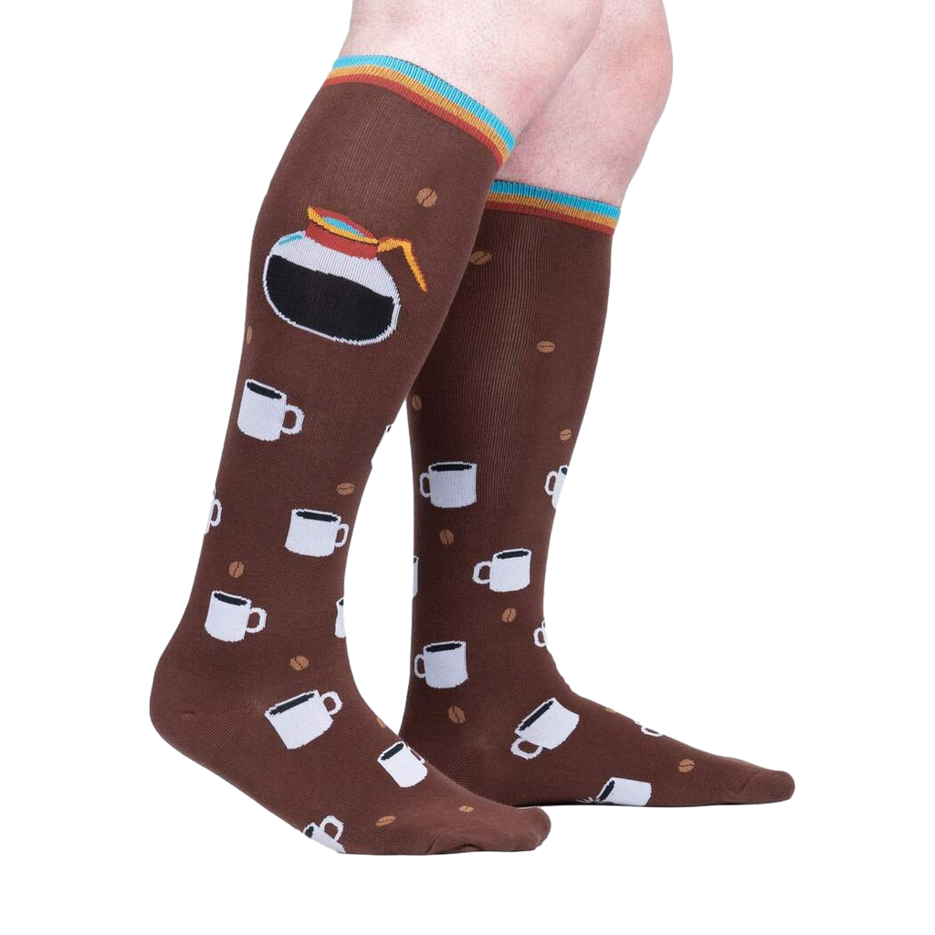 Lifestyle shot of a person's legs wearing the 'Pothead' coffee socks.  Shows how the socks look when worn.