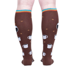 Rear view of a person wearing the 'Pothead' coffee socks, highlighting the full design.