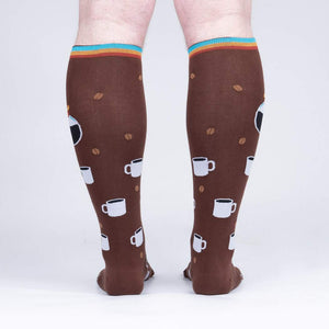 Brown knee-high socks with a pattern of white coffee cups and brown coffee beans.
