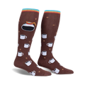 Pair of brown knee-high socks with a repeating pattern of coffee cups and coffee beans. A coffee pot is featured prominently on the calf area. Multicolored stripes at the top.