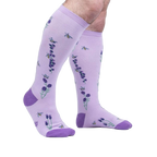 Lifestyle shot showing the socks on a person's legs, showcasing the fit and design.