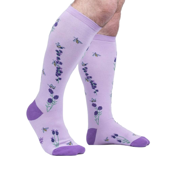 Lifestyle shot showing the socks on a person's legs, showcasing the fit and design.