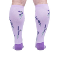 Rear view of the socks on a person's legs, highlighting the back design details.