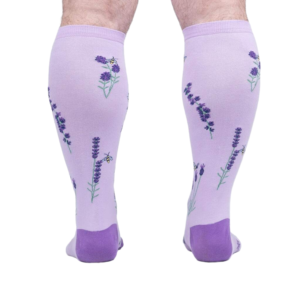 Rear view of the socks on a person's legs, highlighting the back design details.