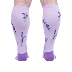 Rear view of the socks on a person's legs, highlighting the back design details.