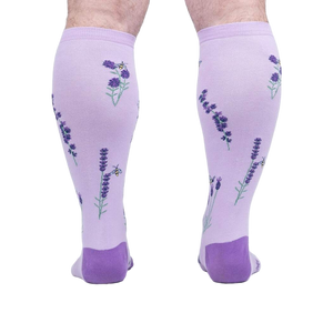 Rear view of the socks on a person's legs, highlighting the back design details.