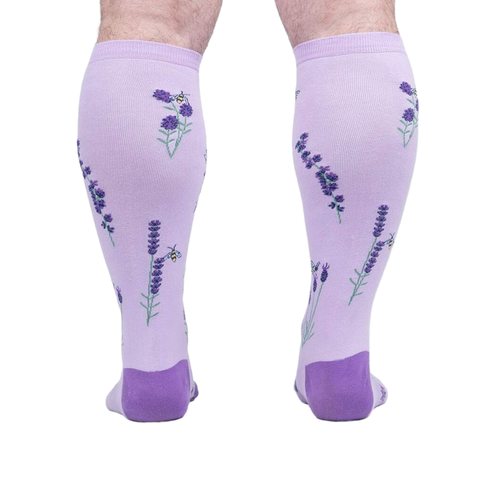 Rear view of the socks on a person's legs, highlighting the back design details.