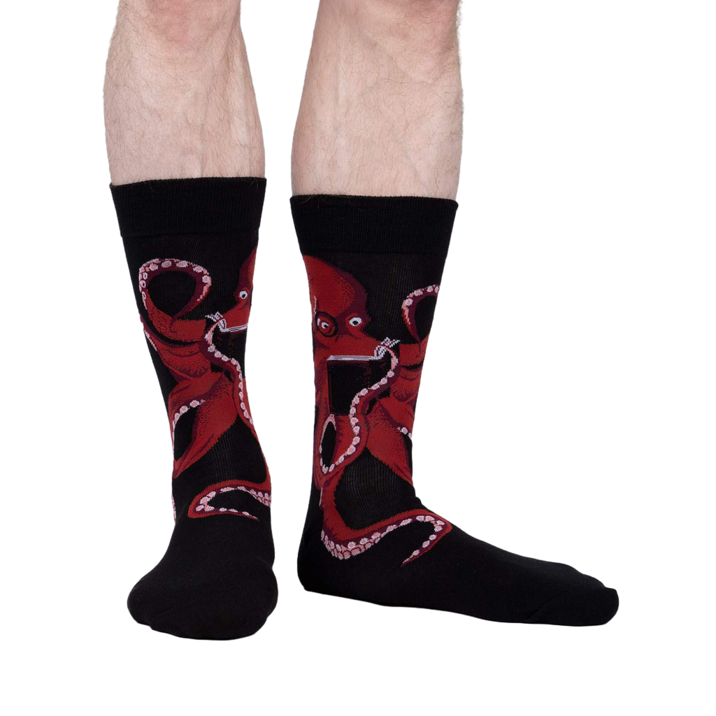 Lifestyle shot of a man's legs wearing the black octopus socks; showcasing fit and style.