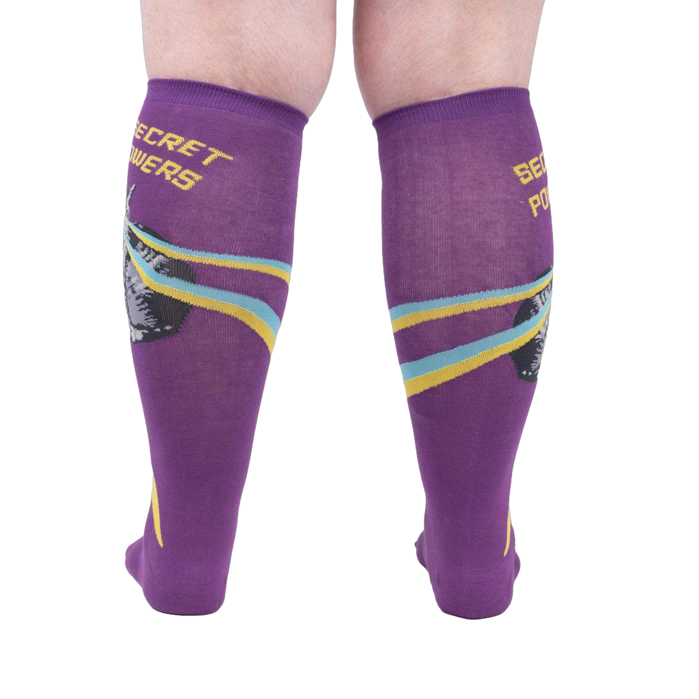 Rear view of a person wearing the purple 'Secret Powers' knee-high socks showcasing the design on the back of the socks.