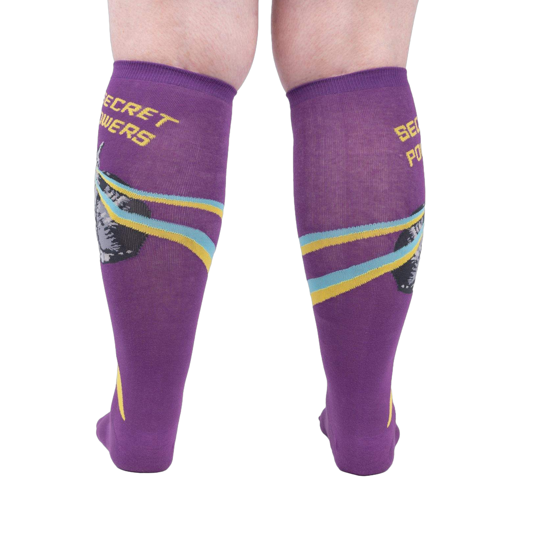 Rear view of a person wearing the purple 'Secret Powers' knee-high socks showcasing the design on the back of the socks.