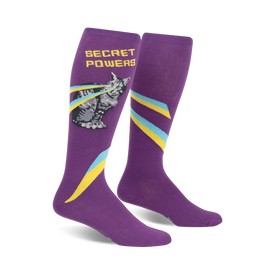 secret powers knee-high socks for women feature a one-eyed cat with rainbow laser eyes on a purple background. 