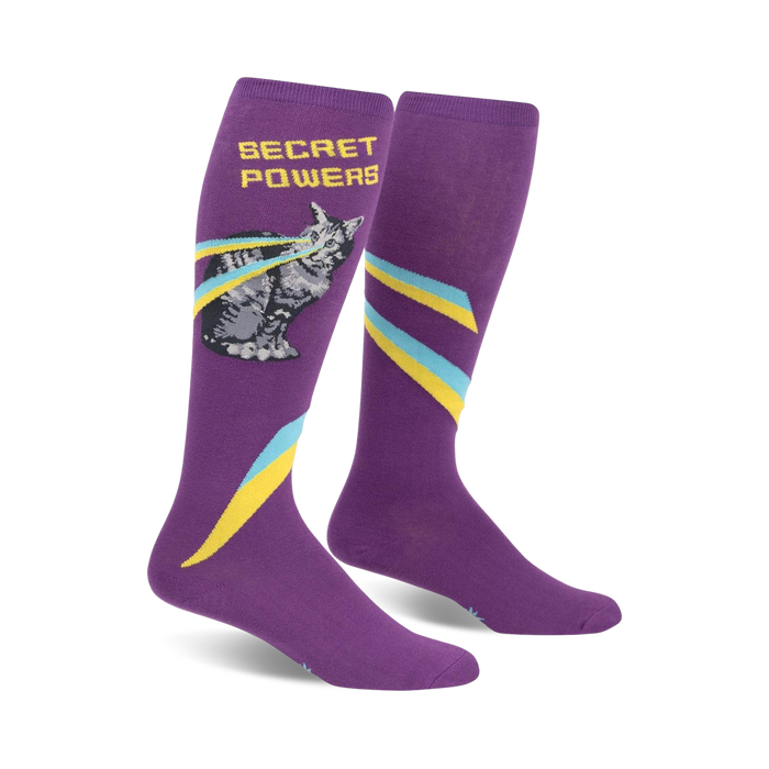 secret powers knee-high socks for women feature a one-eyed cat with rainbow laser eyes on a purple background. 