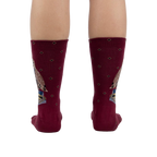 Back view of the socks worn on a person's legs, showcasing the design on the back of the socks.