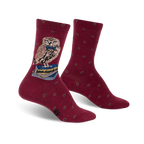 Burgundy crew socks with a brown owl wearing a bow tie and perched on a stack of books. Small diamond pattern adorns the socks.
