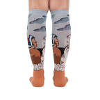 Back view of The Two Fridas socks on a person's legs, highlighting the sock's full design and detailing.