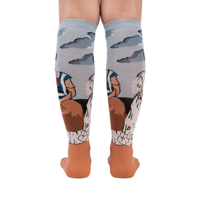 Back view of The Two Fridas socks on a person's legs, highlighting the sock's full design and detailing.