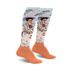 knee-high socks featuring frida kahlo's the two fridas painting, with sky blue tops and orange bottoms.  