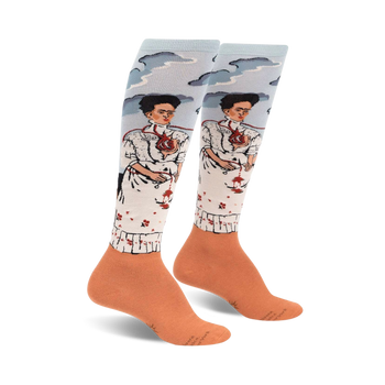 knee-high socks featuring frida kahlo's the two fridas painting, with sky blue tops and orange bottoms.  