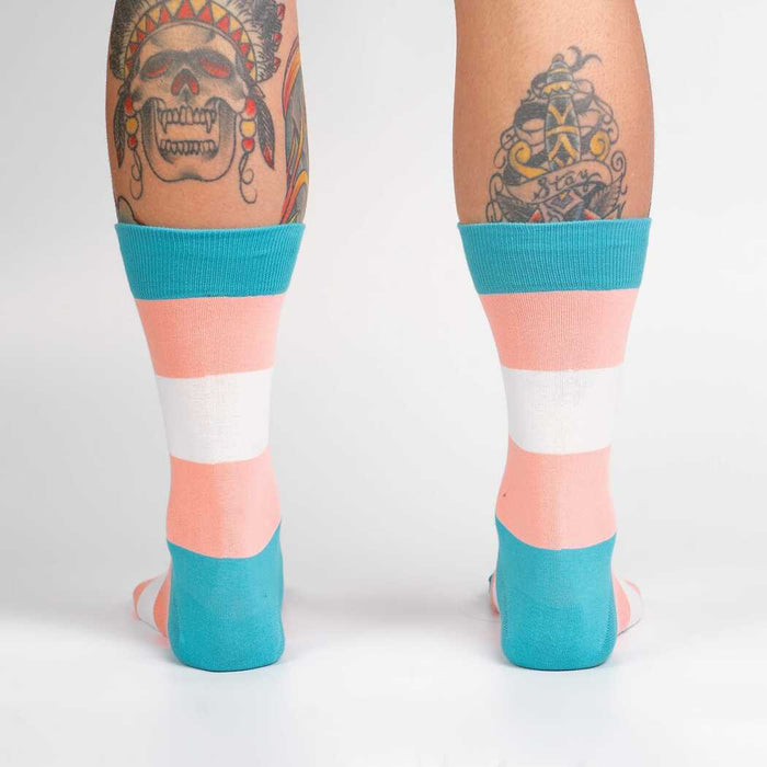 A pair of calf-high socks with light blue, white, and pink stripes.
