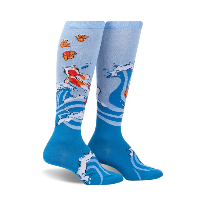 blue knee-high socks for women with orange and white koi fish design and orange leaves, title: beauty in water  