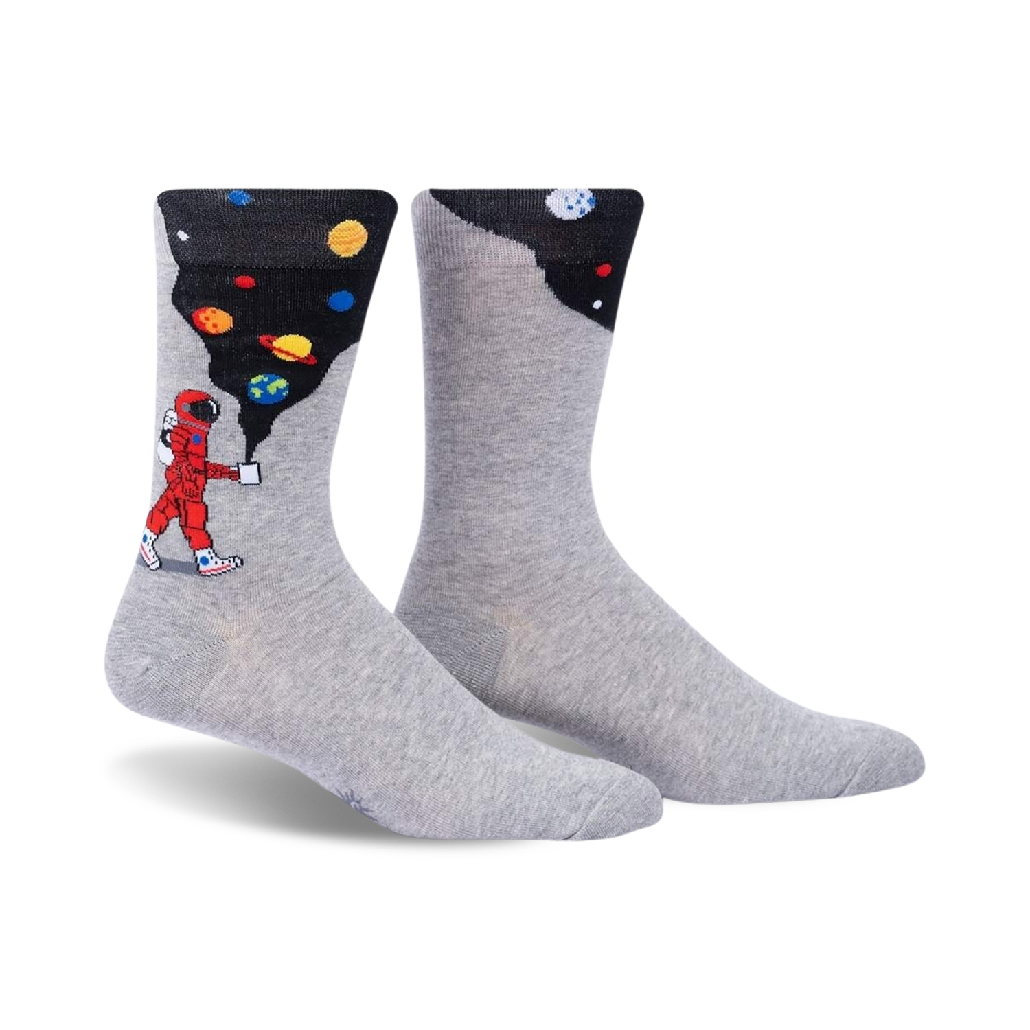 Pair of grey crew socks with a design featuring an astronaut painting planets onto a dark background. 