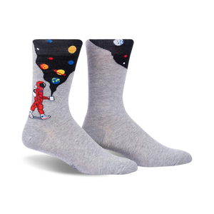 gray crew socks featuring an astronaut walking on the moon with planets and stars in the background.   
