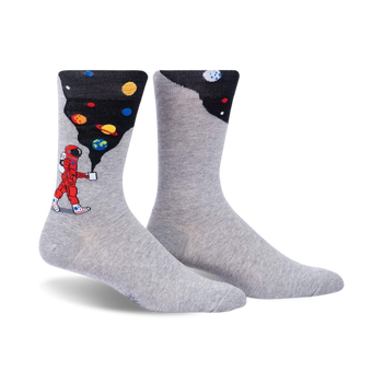 gray crew socks featuring an astronaut walking on the moon with planets and stars in the background.   
