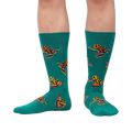 Lifestyle shot showing the Poison Dart Frog socks on a person's legs, showcasing the fit and pattern.