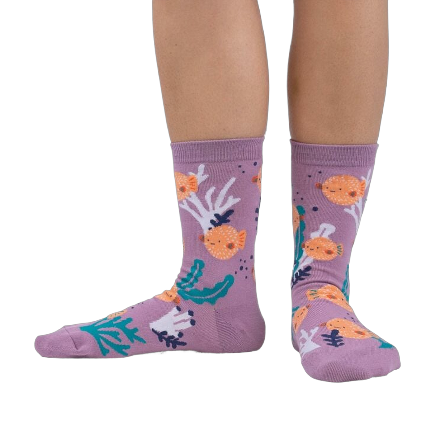 Lifestyle shot showing the pufferfish socks on a person's feet. The socks are crew length and feature a fun design.