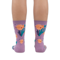 Rear view of a person wearing the lavender crew socks, showcasing the full design.