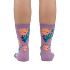 Rear view of a person wearing the lavender crew socks, showcasing the full design.