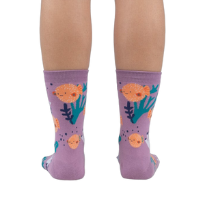 Rear view of a person wearing the lavender crew socks, showcasing the full design.