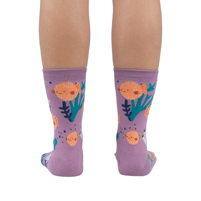 Rear view of a person wearing the lavender crew socks, showcasing the full design.