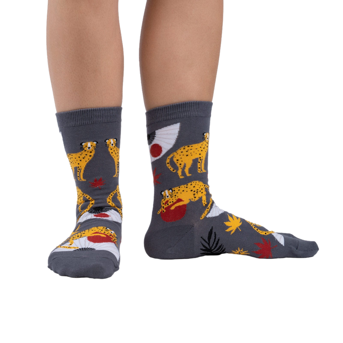 Lifestyle shot showing the socks on a person's legs against a white background.